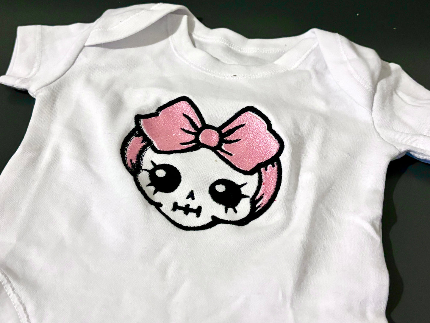 Skull baby grow