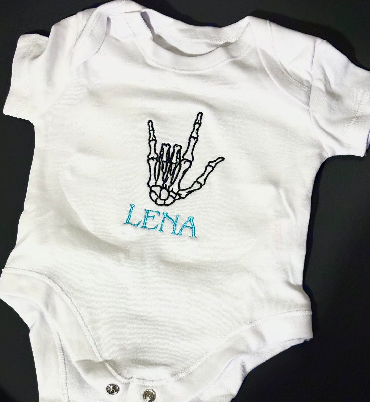 Skeleton baby grow 