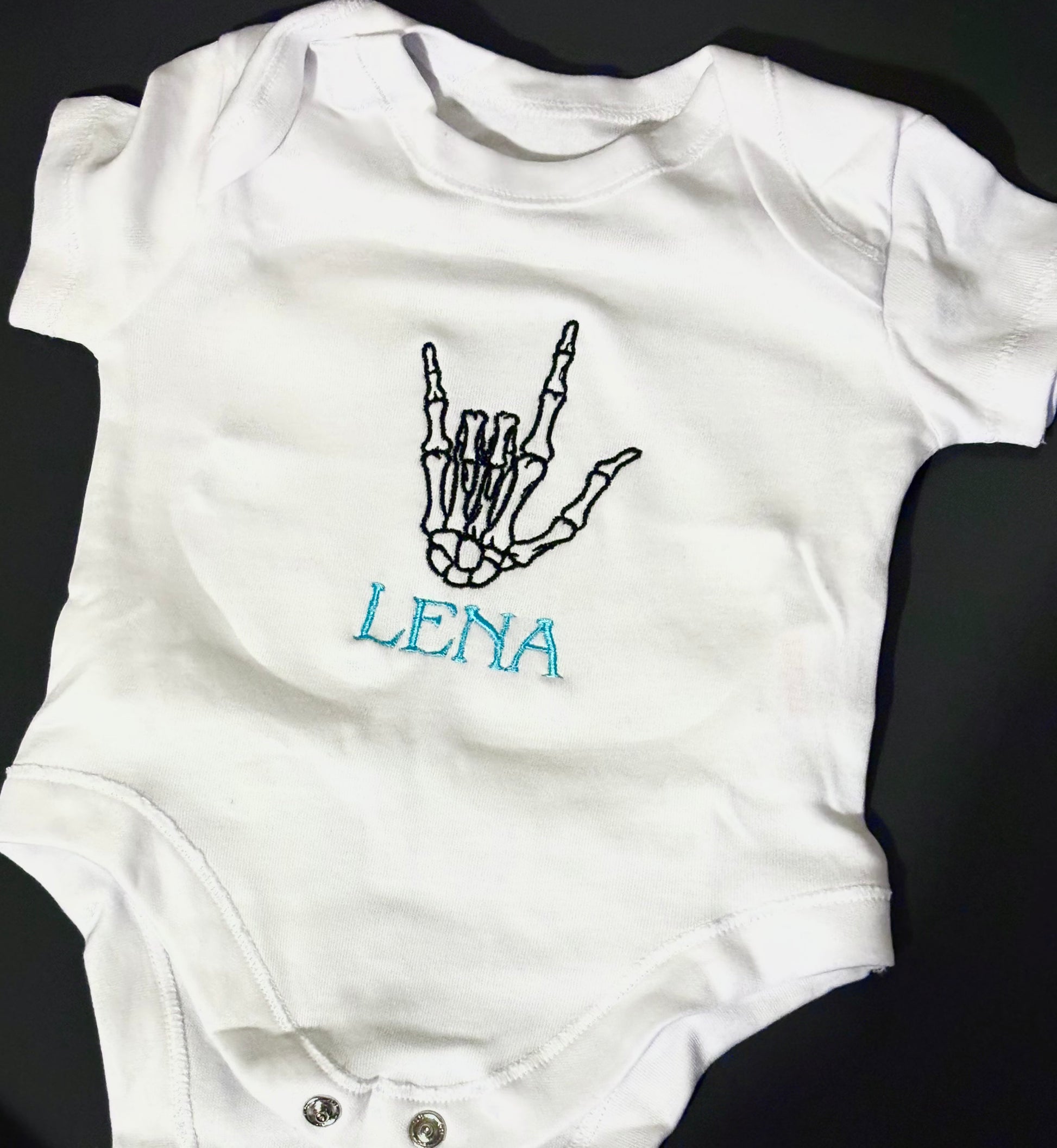 Skeleton baby grow 